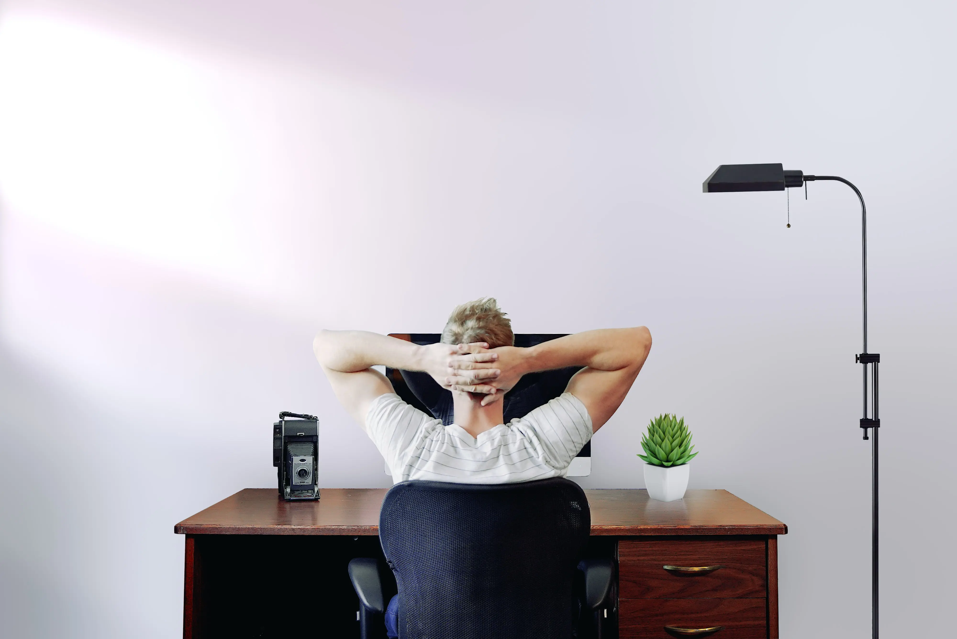 Man sitting at desk - supporting staff to prevent burnout