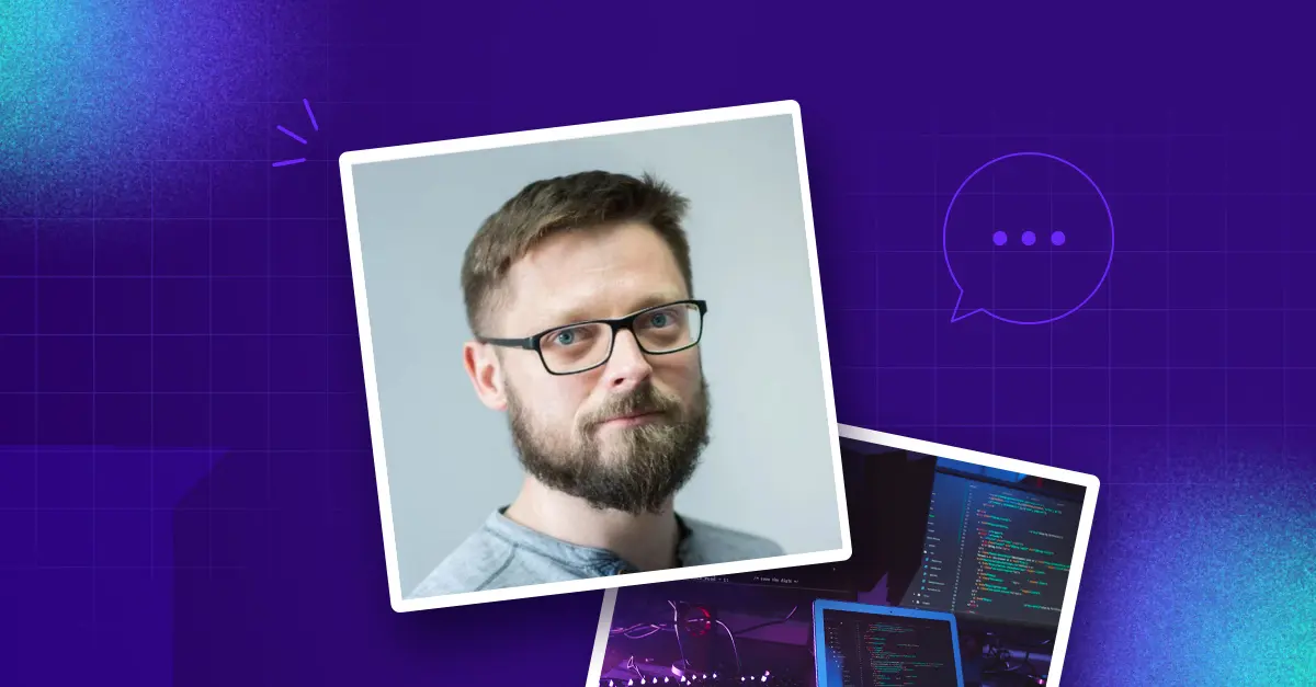 Picture of white man with glasses against a blue background